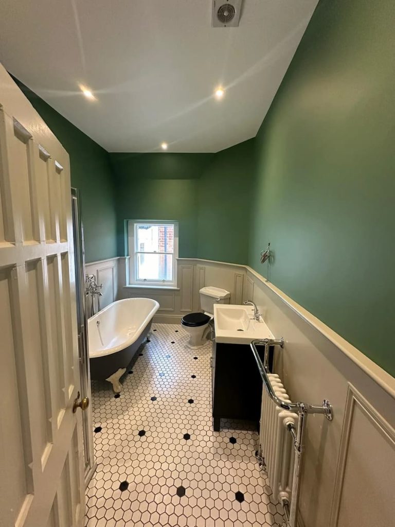 a bathroom with a tub and sink
